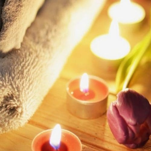 spa composition for massages with towels and candles