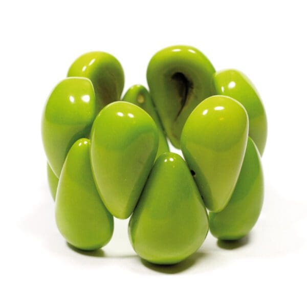 A green Tagua Raindrop Bracelet is shown in the image