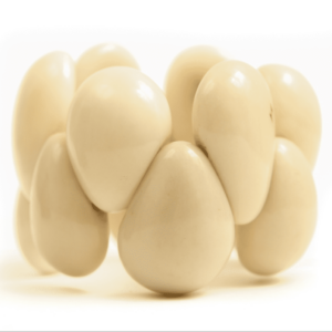 A group of white eggs sitting on top of each other.