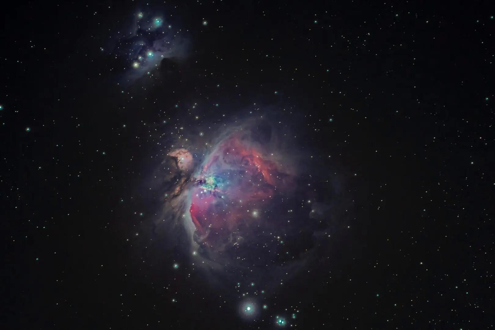 A picture of the orion nebula taken by a telescope.